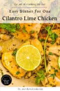 Cooked chicken pieces garnished with cilantro and lime slices in a pan, promoting an easy cilantro lime chicken dinner recipe for one.